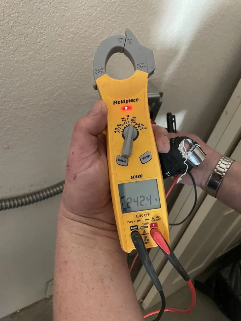 Voltage testing with clamp meter during Electrical Installation Services in Kinderhook